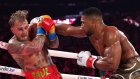 Anthony Joshua flattens Jake Paul with sixth-round KO, breaks boxer’s jaw