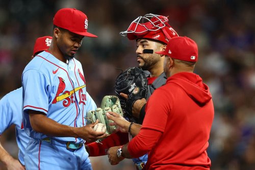 Cardinals and Rockies tilt their caps in support of rookie after umpire dispute