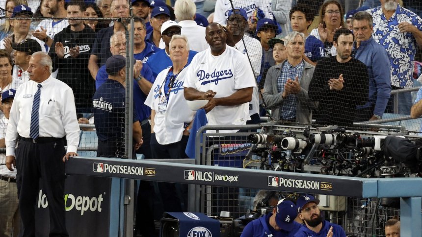 Magic Johnson’s business ties to Mark Walter face scrutiny amid reported $2 billion in loans